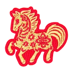 A gold horse with a red outline and floral details on its body.