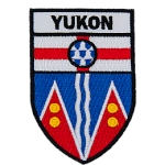 Yukon is stitched above the Yukon provincial flag in the shape of a shield.
