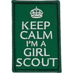 The words Keep Calm I'm A Girl Scout on a green background.