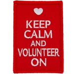 The words Keep Calm And Volunteer On on a red background.