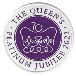 Circle badge with the Queen’s crown on a backdrop of royal purple with a white ring.
