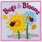 A yellow and blue flower has a ladybug on them. The words Bugs & Blooms are across the top. Two yellow butterflies are to the side.