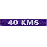 The number 40 KMS is stitched in white on a purple background.