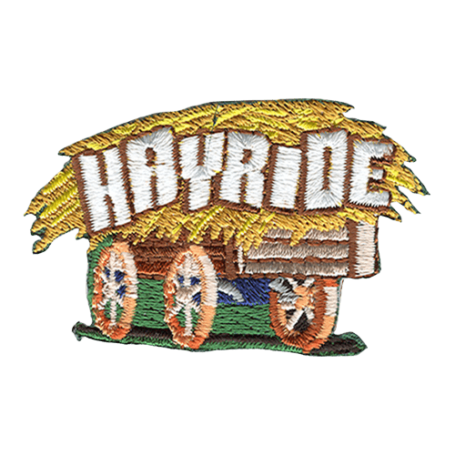 An old wooden wagon hauls a huge load of golden hay with the word ''Hayride'' embroidered in all capital letters.