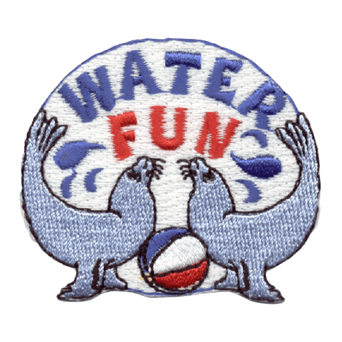 Two seals face each other with their tails curved in the air. A ball sits between them. The words Water Fun are stitched above them.