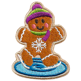 A gingerbread person skates on ice with a pink and green hat and scarf.