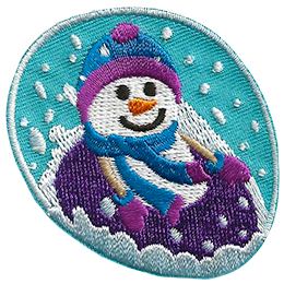A smiling snowperson in mitts and a toque tubes down a hill in a purple tube.