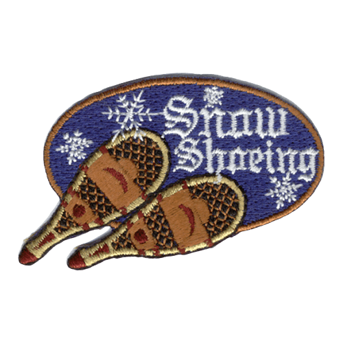 A pair of wooden snow shoes sits underneath the words Snow Shoeing.
