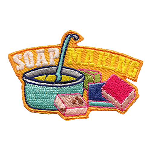 The words Soap Making are above a pot of liquid soap and four coloured bars.