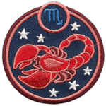 This circular crest displays a red scorpion surrounded by stars. The sign of Scorpio sits above it.