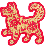 A gold dog in a red outline and detailing.