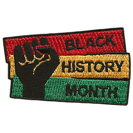 A fist pumps the air in solidarity with Black History Month.