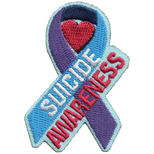 The purple and blue suicide awareness ribbon is displayed with a red heart inside the curl of the ribbon. The fore of the ribbon is blue and has the word 'Suicide' on it. 'Awareness' sits just underneath at the same angle.