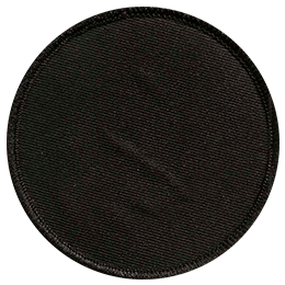 A blank, circular black badge.