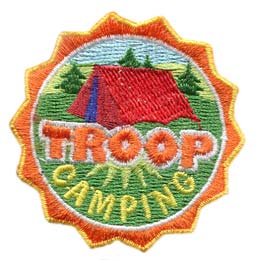 This round crest displays the text Troop Camping with a tent set up in a grassy field.