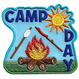A marshmallow and hotdog roast over a fire. The words Camp Day are above and on the right.