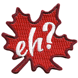 A red maple leaf sits at a fifteen-degree angle. The word Eh? is embroidered in white in the leaf's center.