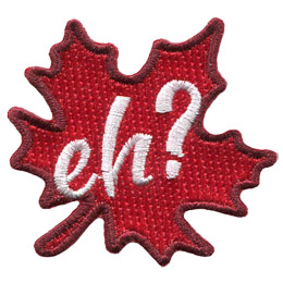 A red maple leaf sits at a fifteen-degree angle. The word Eh? is embroidered in white in the leaf's center.