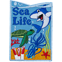A shark, turtle, and squid swim over coral and seaweed on this vertical Sea Life patch.
