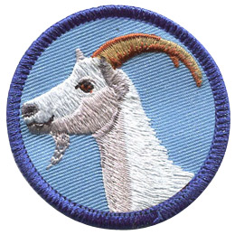 This merrow bordered circle badge displays the profile of a white goat with arching horns.