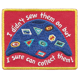 A camp blanket covered in patches, crests, and badges. The text reads, I didn't sew them on but I sure can collect them!