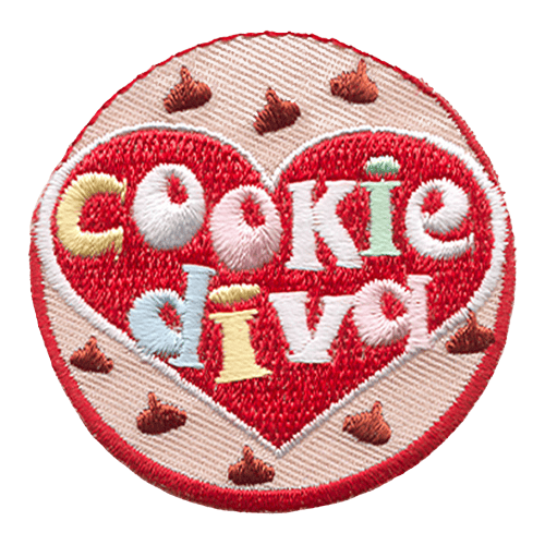 A large red heart with the words Cookie Diva surrounded by a pink circle and chocolate chips.