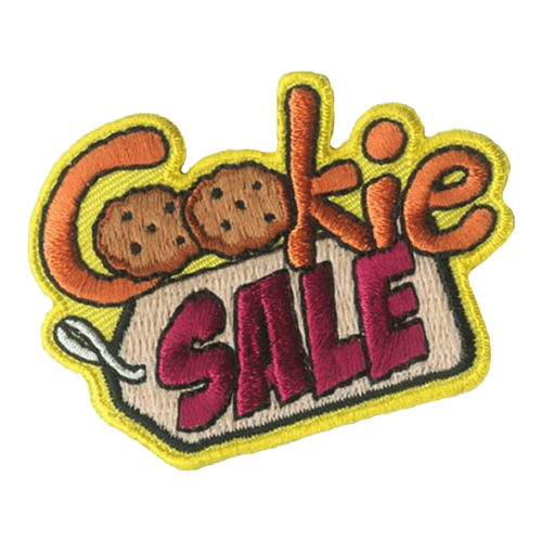 The words Cookie Sale make up this patch. The Os are two cookies, and sale is stitched onto a tag.