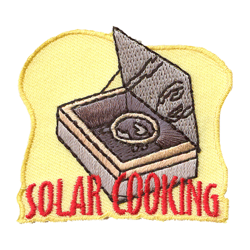 A box wrapped in tinfoil. The words Solar Cooking are below it.
