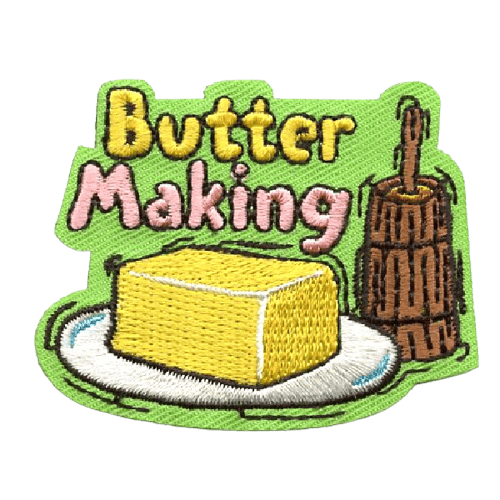 A slab of butter rests on a plate next to a churner on this butter-making patch.