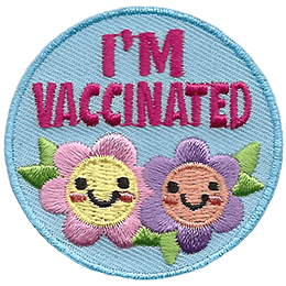 This round crest has the text I'm Vaccinated above two smiling flowers.