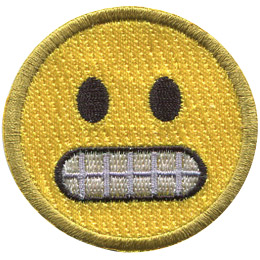 A yellow circle forms an emoji with wide black eyes and gritted teeth.