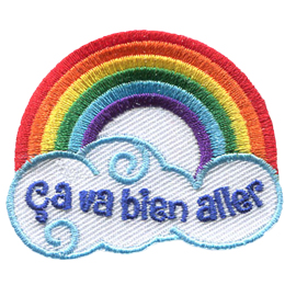 A rainbow arches over a cloud with the words Ça va bien aller inside.