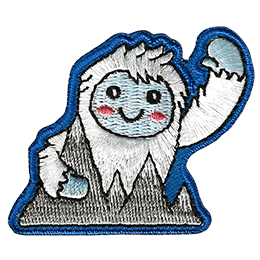 This happy yeti waves a warm welcome as they hold onto the Himalayan Mountains.