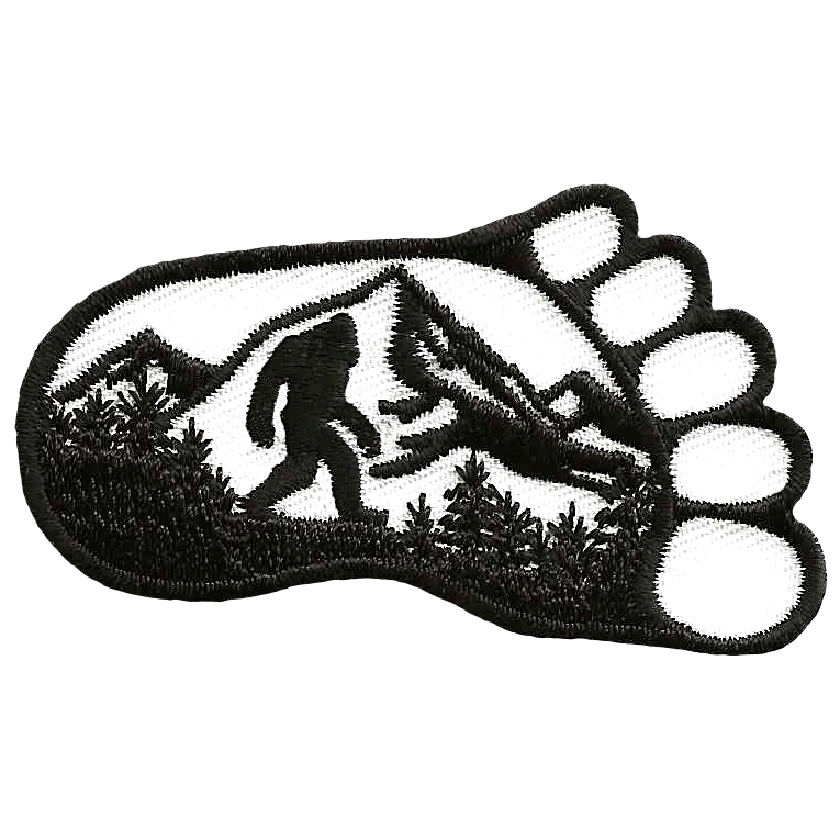Bigfoot walking through the woods inside a footprint.