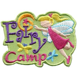 A blonde fairy with clear wings adds the dot to the I in Fairy Camp with her wand.