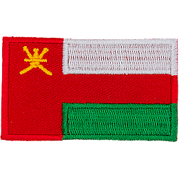 The national flag of Oman consists of three stripes (white, green and red) with a red bar on the left that contains the national emblem of Oman (a dagger and two swords).