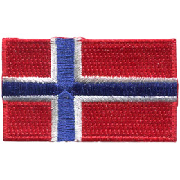The flag of Norway is broken up into four sections by a white bordered blue cross. The two left hand sections are both smaller than the two right hand sections. Each of the for sections are a solid red colour.