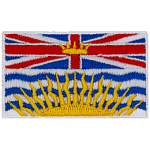 At the top of the BC flag is a rendition of the Royal Union Flag, defaced in the centre by a crown, and with a setting sun below.