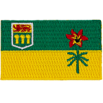 The top bar is green, the bottom bar is yellow. A coat of arms is in the left corner and Saskatchewan's provincial flower is in the right.