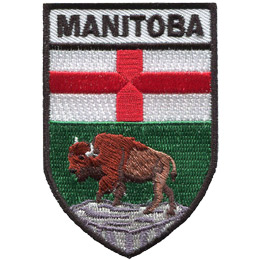 This shield shaped badge is broken into three horizontal sections. The top most bar has the name 'Manitoba'. The second section has a white background with a red cross splitting the background into four even quarters. The last section displays a buffalo standing on a rock with a green background behind it.