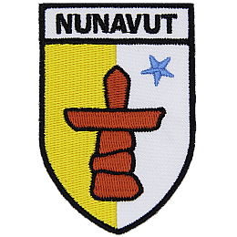 The Nunavut flag is underneath the word Nunavut in the shape of a shield.