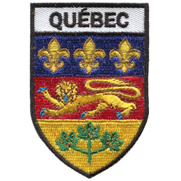 This shield-shaped crest is broken up into three horizontal parts. At the top is the word \'Quebec,\' underneath it is the Quebec flag, and at the bottom are three green maple leaves joined together by one stem.