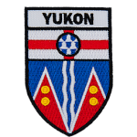 Yukon is stitched above the Yukon provincial flag in the shape of a shield.