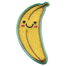 A banana stands upright. Two black dots make its eyes, a big U forms a smile, and pink blush colours the banana\'s cheeks.