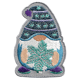 A gnome wearing a blue toque holding a snowflake.