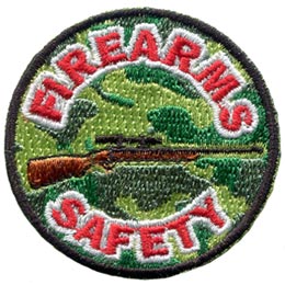 This light and dark green camouflage patch depicts a rifle with the words Firearms Safety embroidered in red and white.
