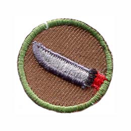 This one inch circle badge depicts a sharp bladed knife with a red handle.