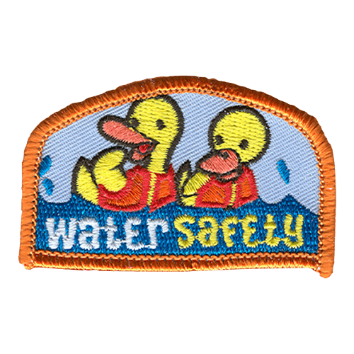 Two ducklings in red lifejackets play in the water. Water Safety is stitched in the water below them.