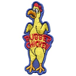 A yellow rubber chicken with a distressed face. The words Rubber Chicken are across its stomach.