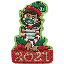 A Christmas elf in a red and green candy-striped shirt sits on the year 2021.